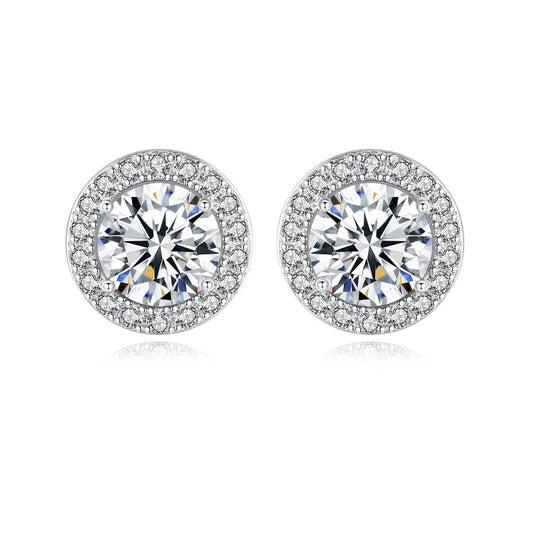 Elegant round diamond earrings with a halo of smaller stones.