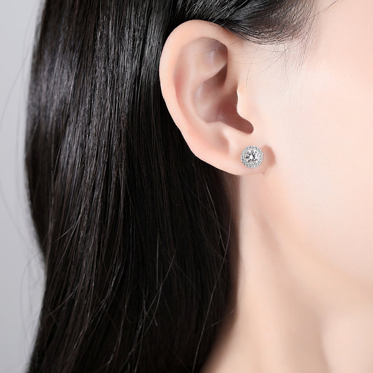 Close-up of an ear with a stud earring in a person's ear.